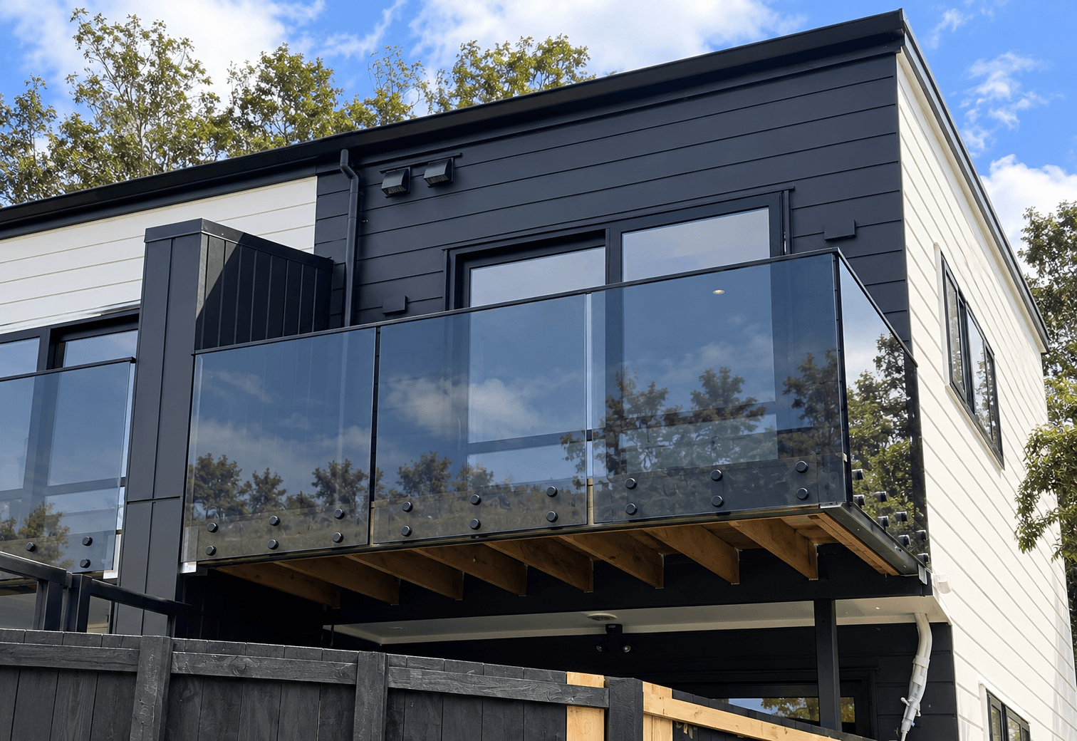 Black standoffs along balcony