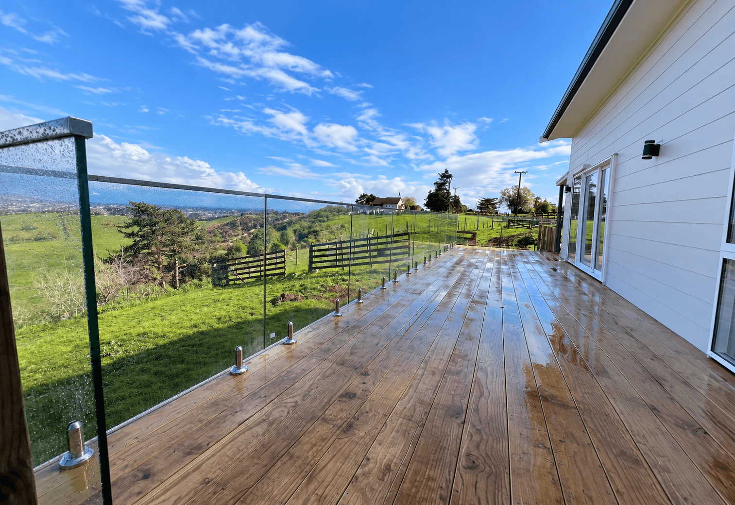 Deck glass balustrade with silver spigots and a silver frame